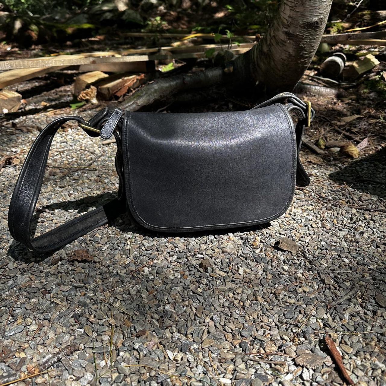black leather vintage coach purse with adjustable crossbody strap