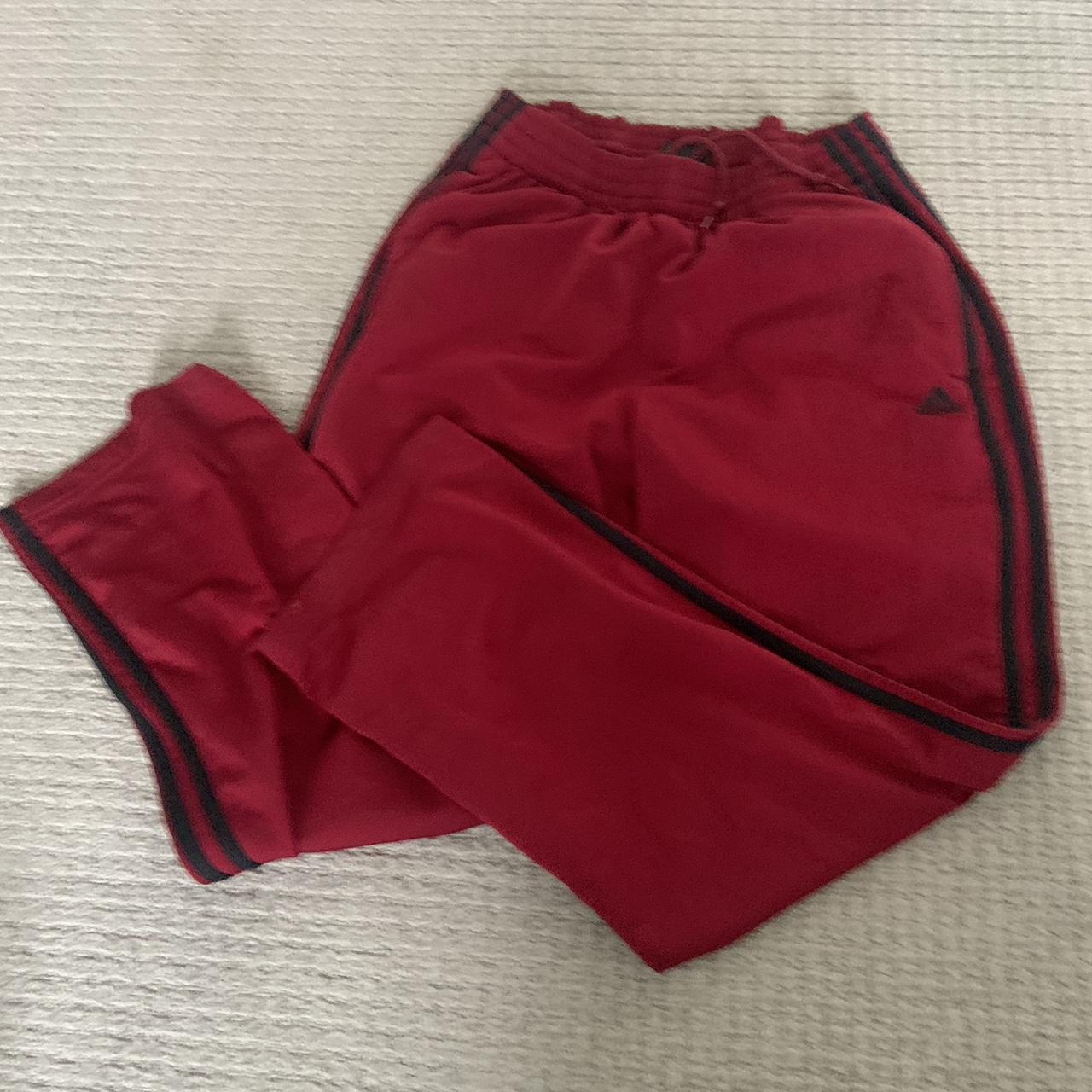 Black with red hot sale stripe adidas pants