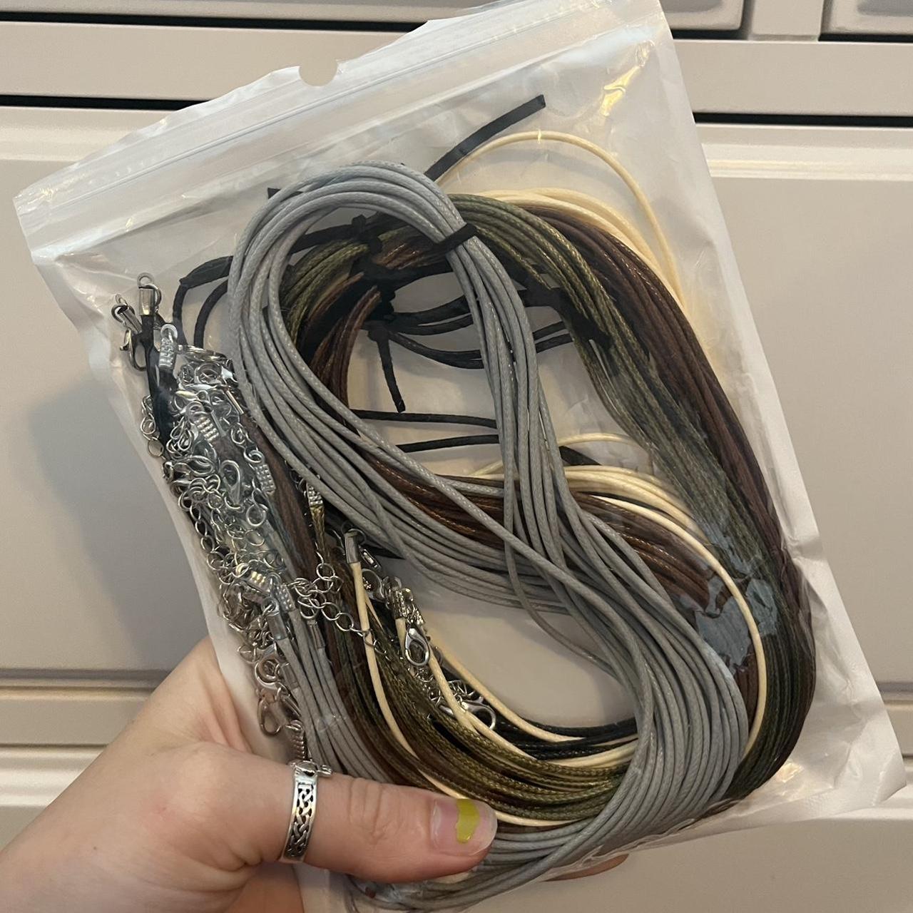 NECKLACE CORDS - opened once, missing four black - Depop