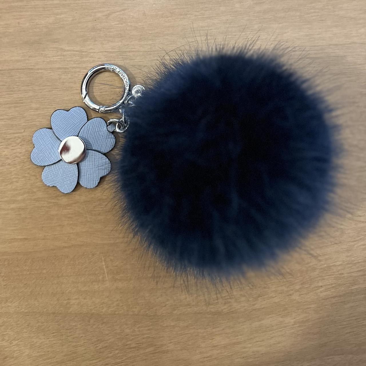 Michael Kors blue and navy fur pom pom keychain with. Depop