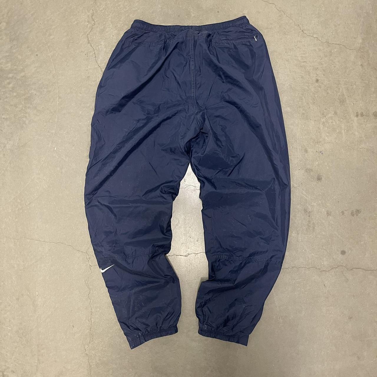 90s/early 2000s nike track pants with zip up ankles - Depop