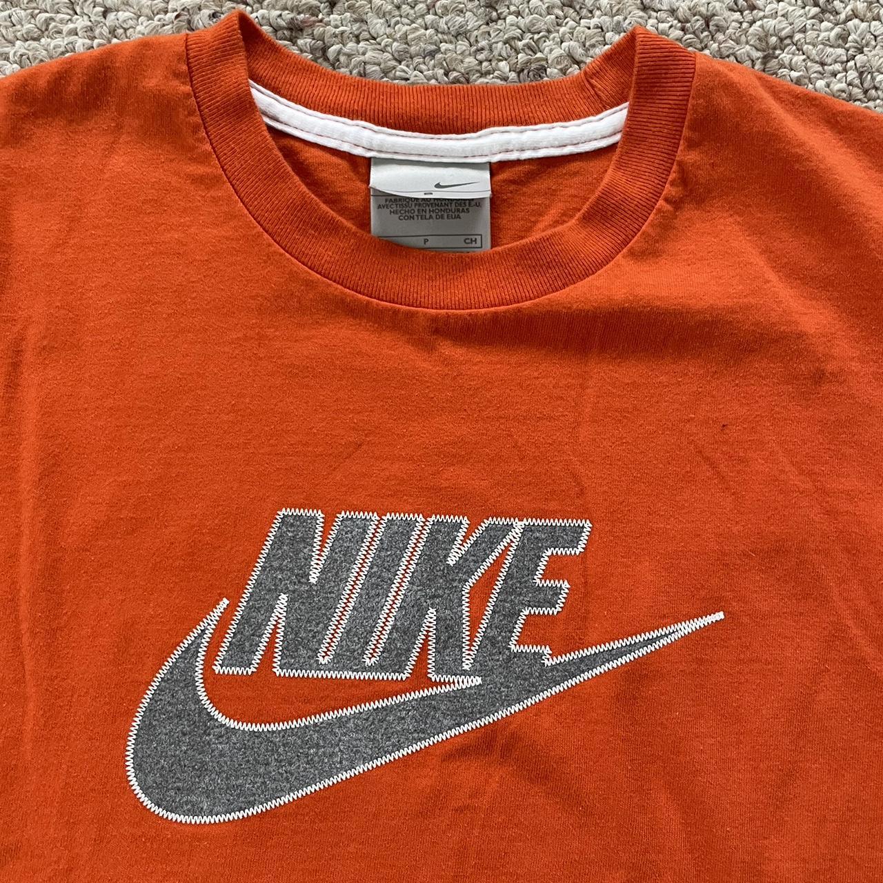 fluorescent orange nike shirt
