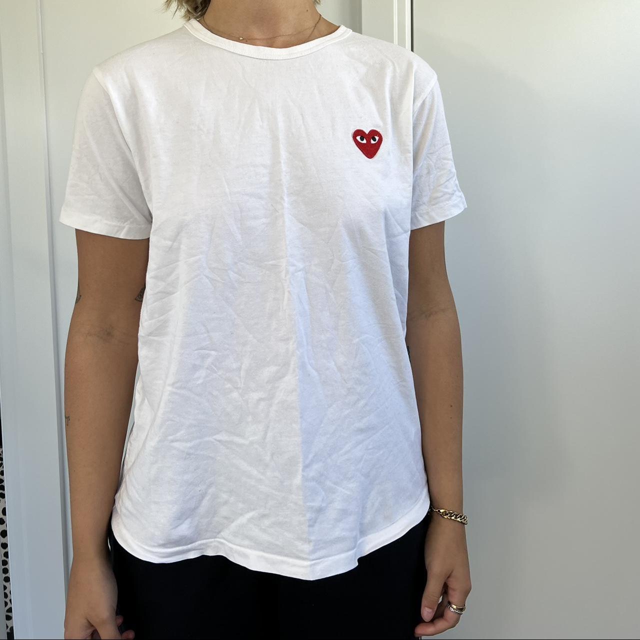 White Comme des Garçons Tshirt model wears size 8... - Depop