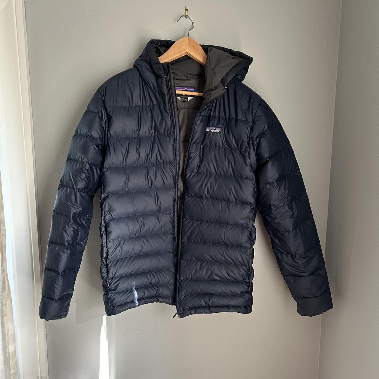 Patagonia down jacket leaking poised feathers