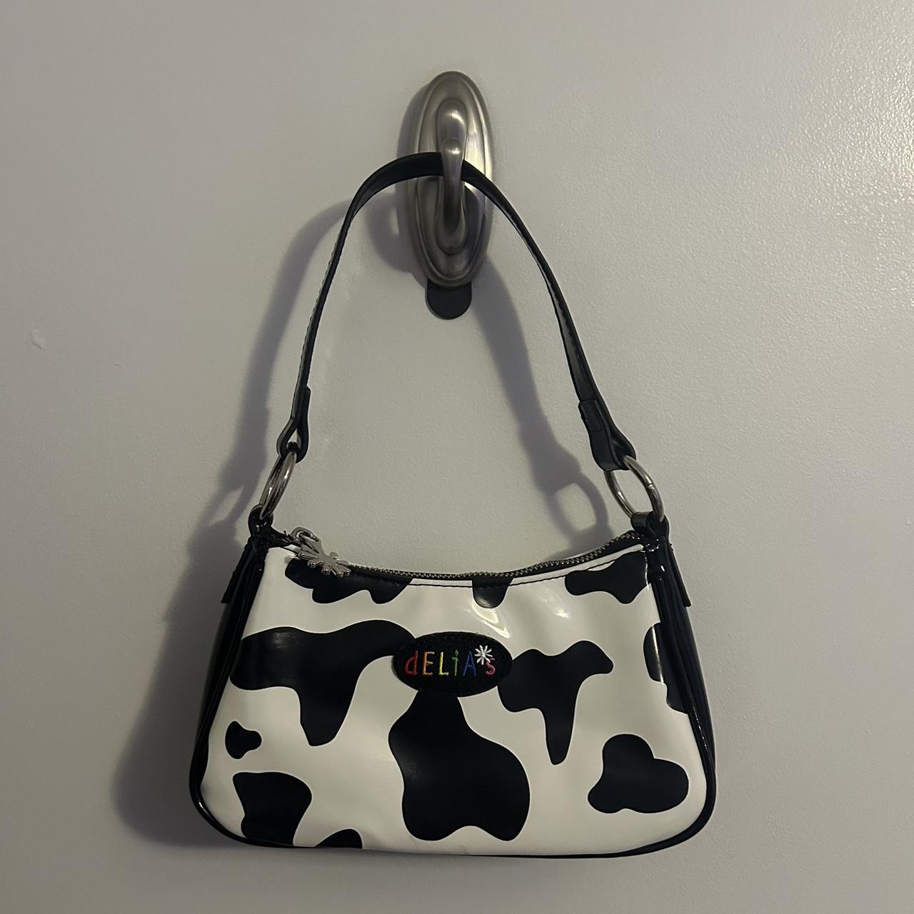 Cute cow print Delia s purse Measurements 5 inch