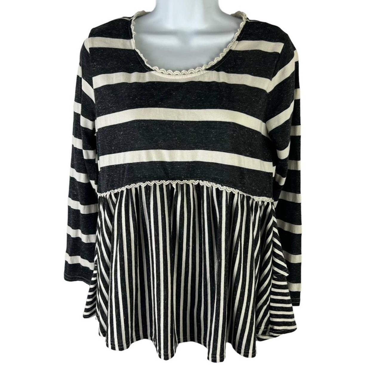 cream blouse with black trim