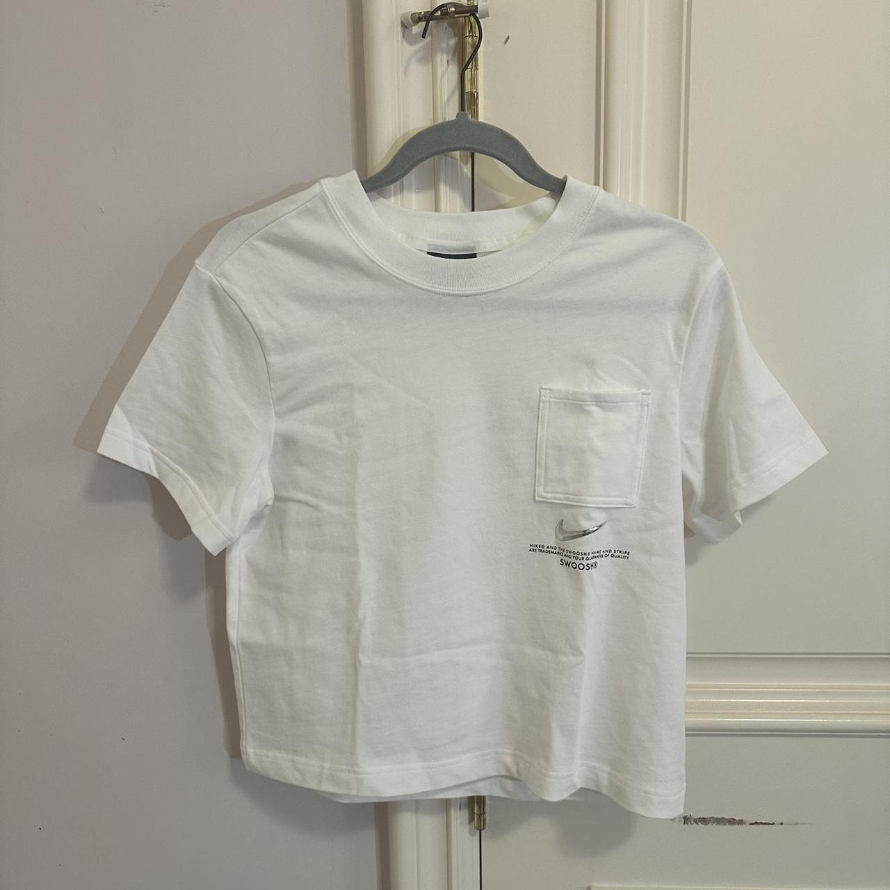 white nike shirt with silver swoosh