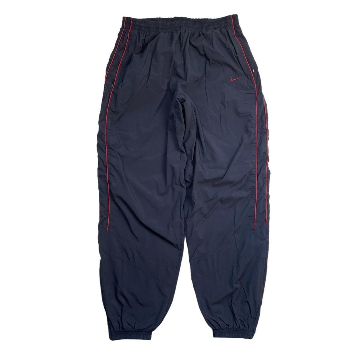 Vintage Nike baggy tracksuit bottoms navy Scuff on... Depop