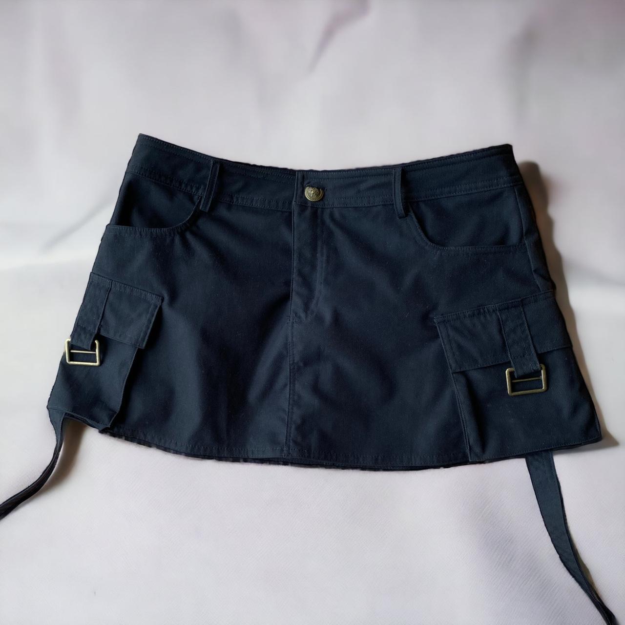short black skirt with pockets on each side. Depop