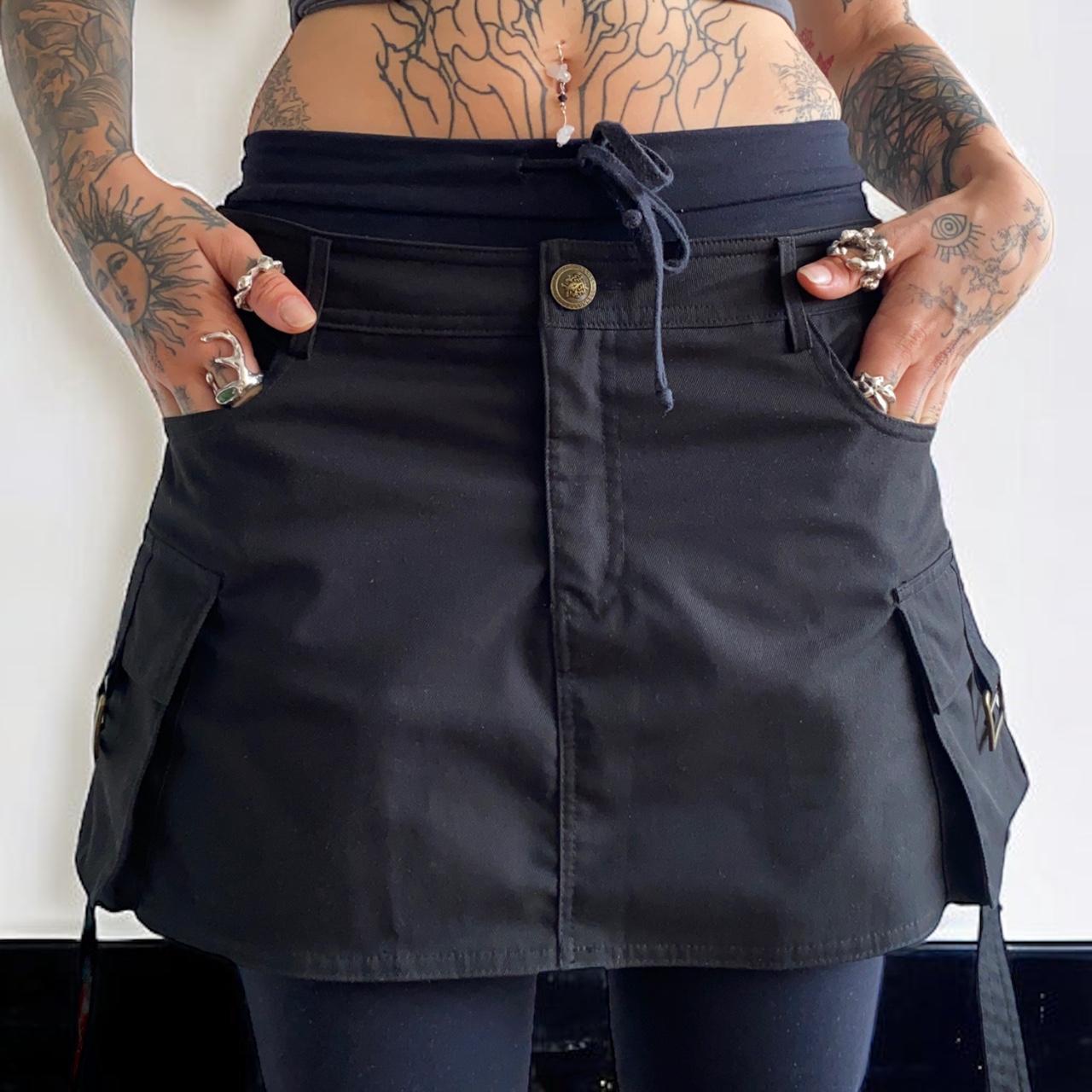 short black skirt with pockets on each side. Depop