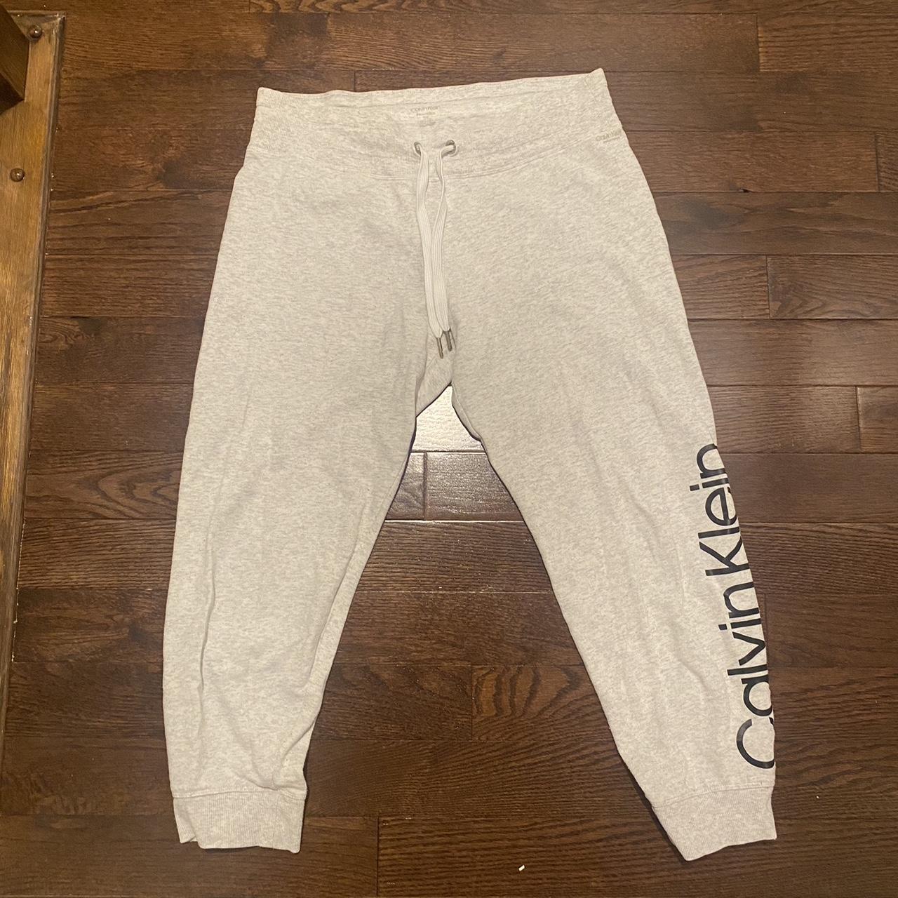 white Calvin Klein low rise sweatpants - Depop