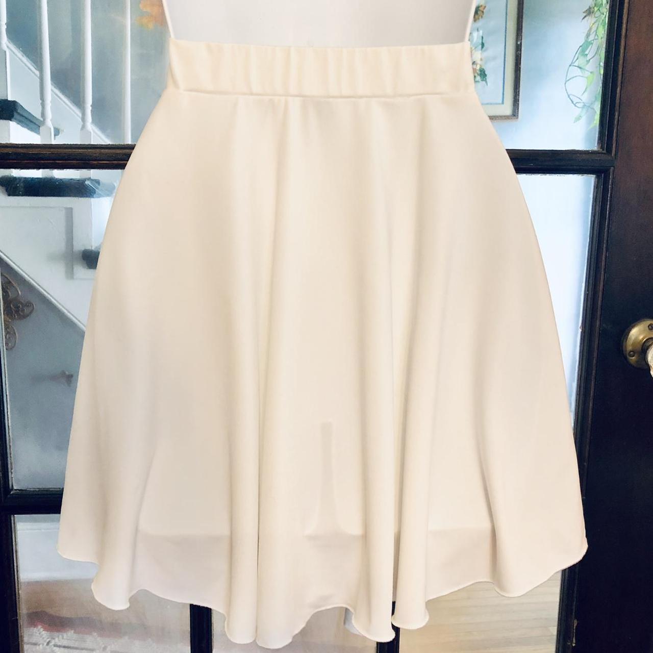 Modern white knit faux wrap skirt with side tie.... - Depop