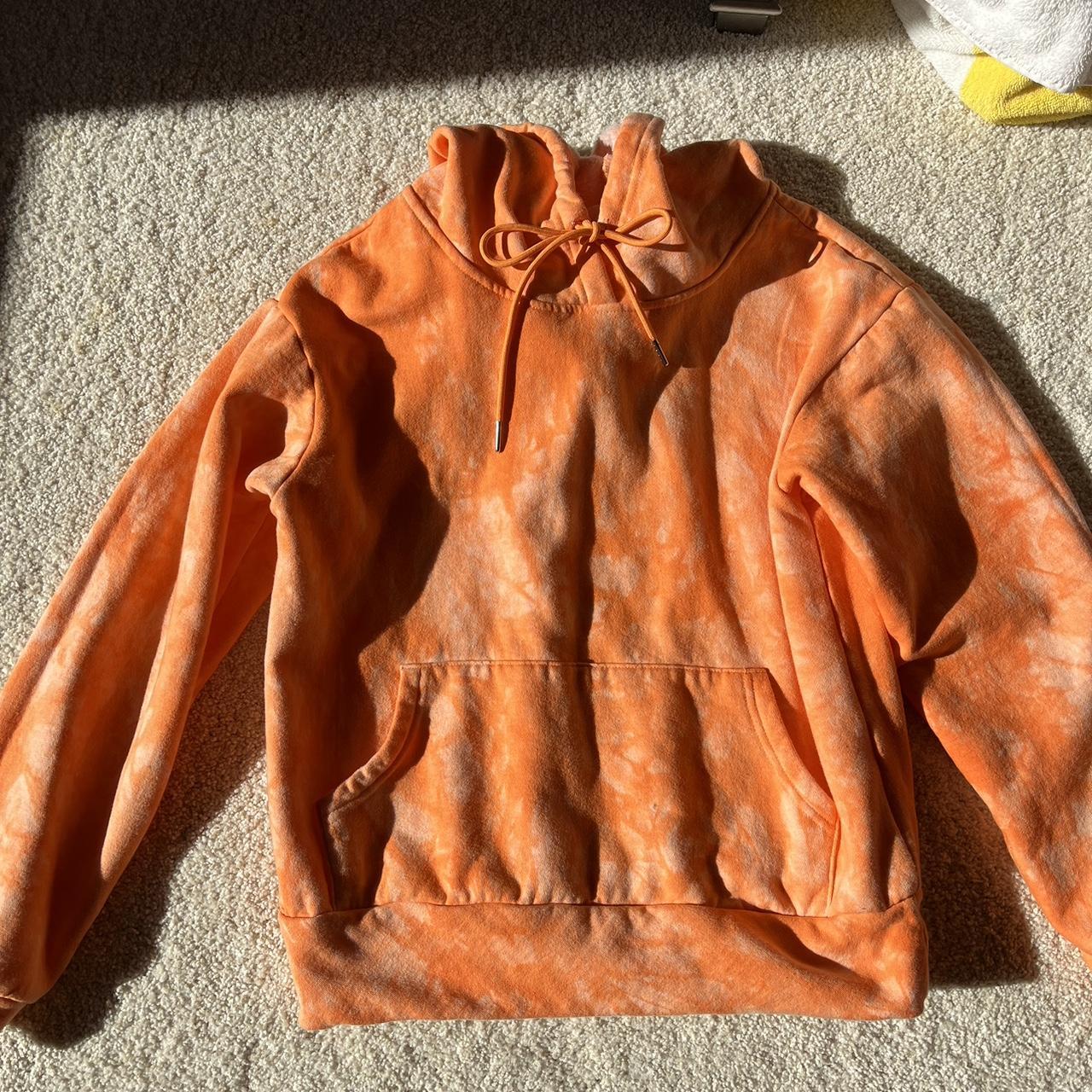 orange tie dye hoodie. super warm on the inside and Depop