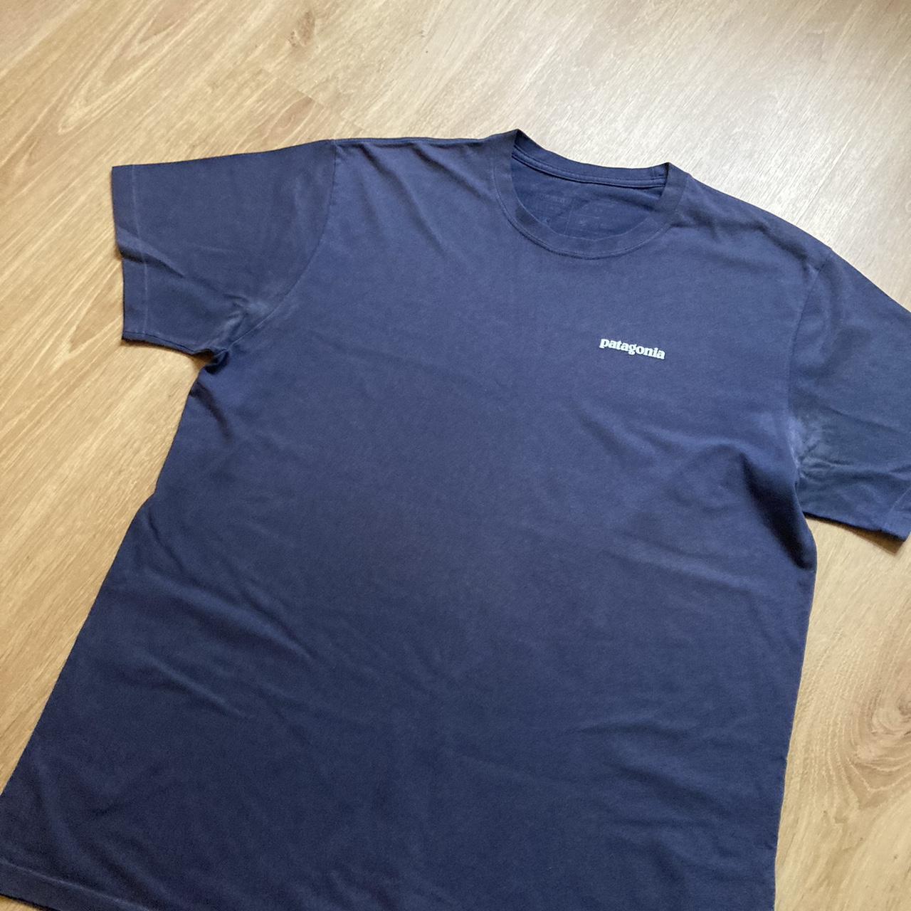 Patagonia tshirt in navy with front and back logo... - Depop