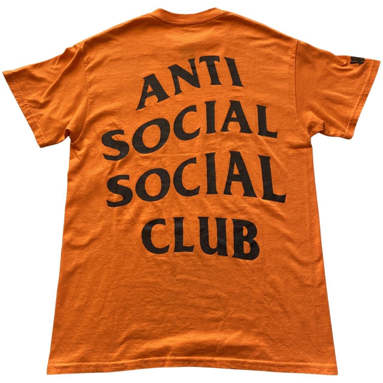 This is an orange ASSC x UNDEFEATED Paranoid tee.... - Depop