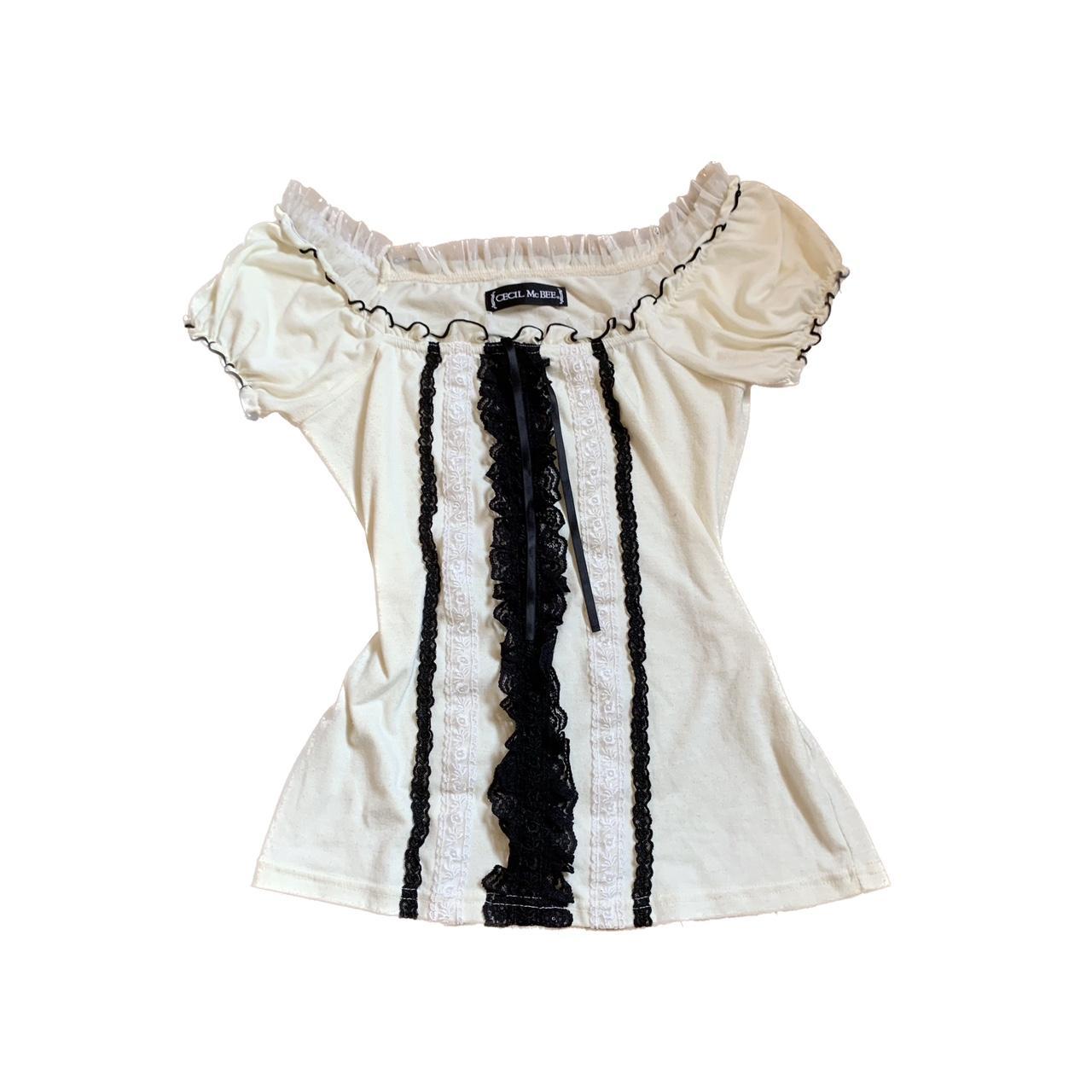 Cute cream colored coquette top Black lace detailing... - Depop