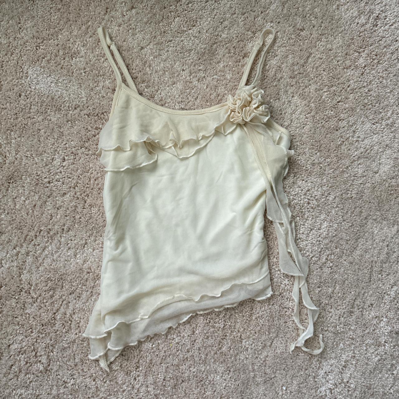 Cream and white asymmetrical cami top with ruffle... - Depop