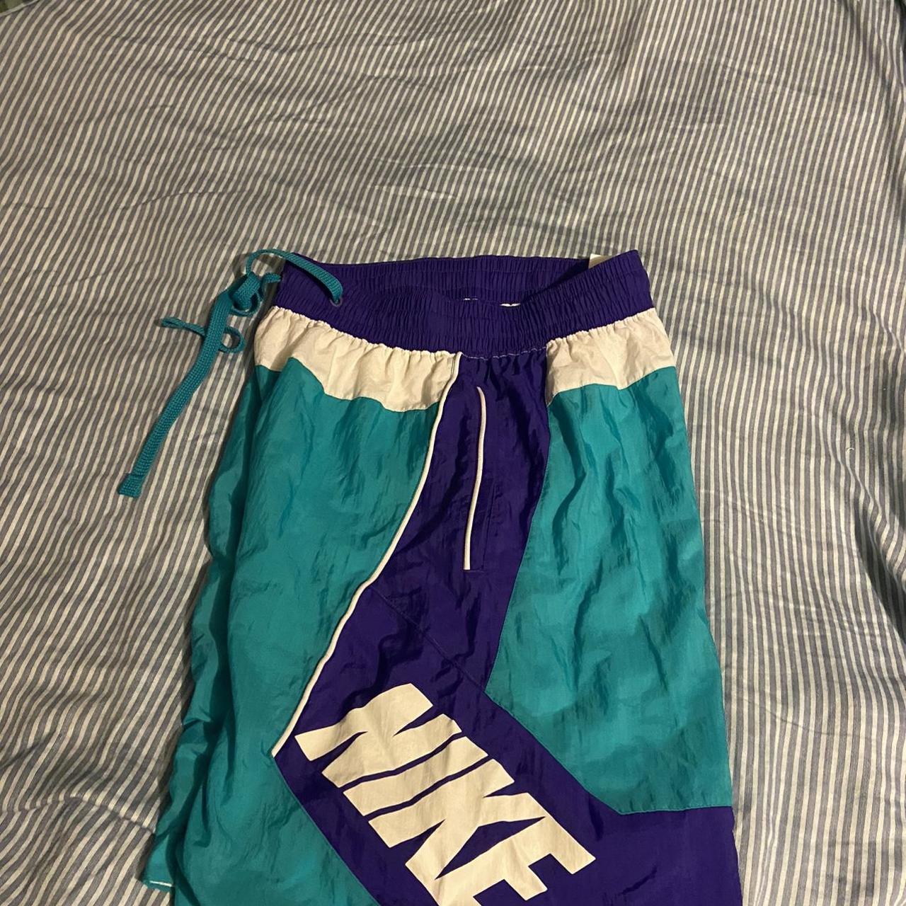 teal and purple nike shorts