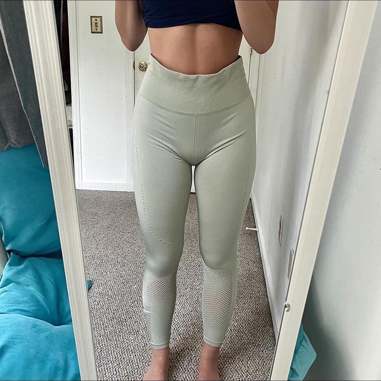 mint green workout leggings with cutouts all over. - Depop