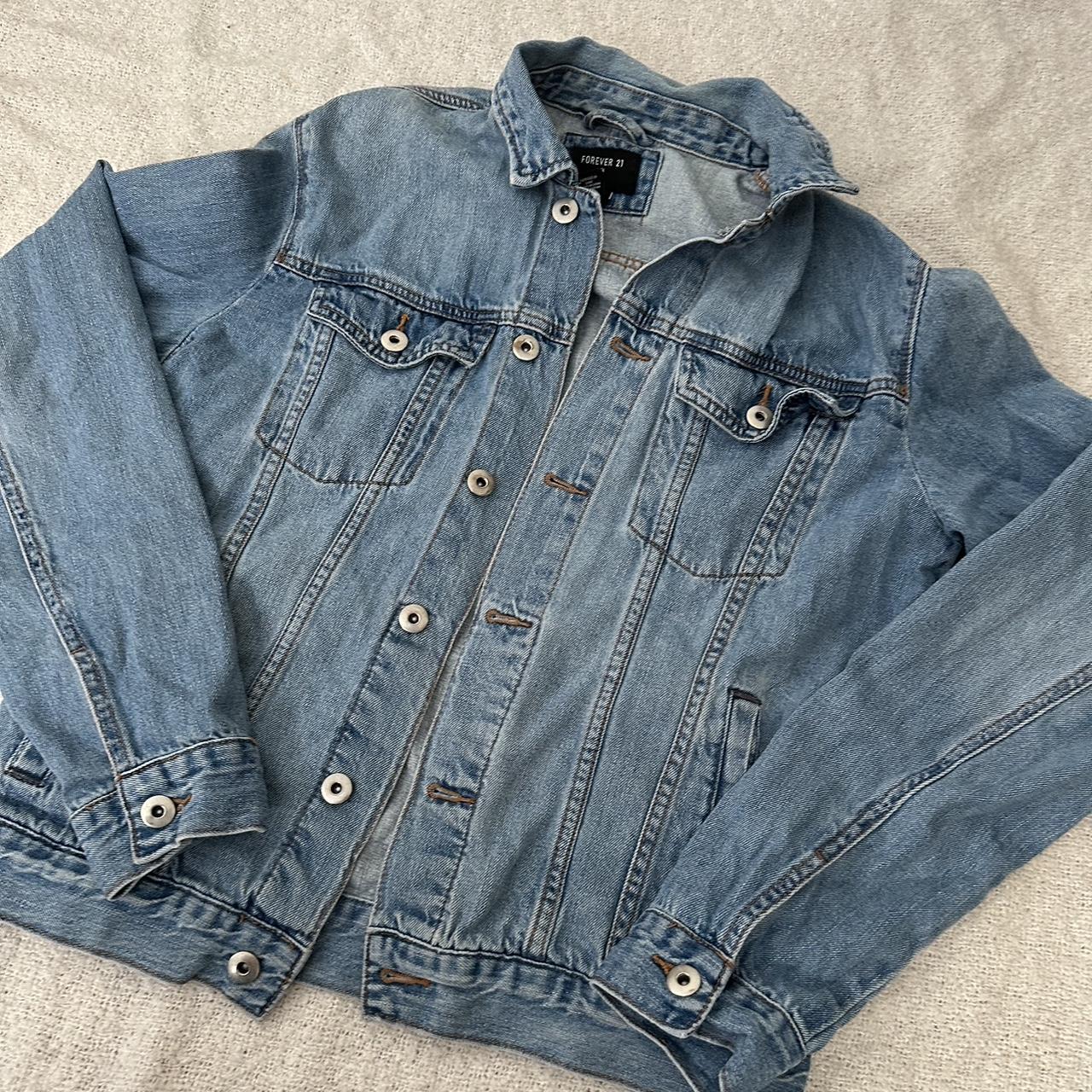 Medium light wash denim jacket with four pockets.... Depop