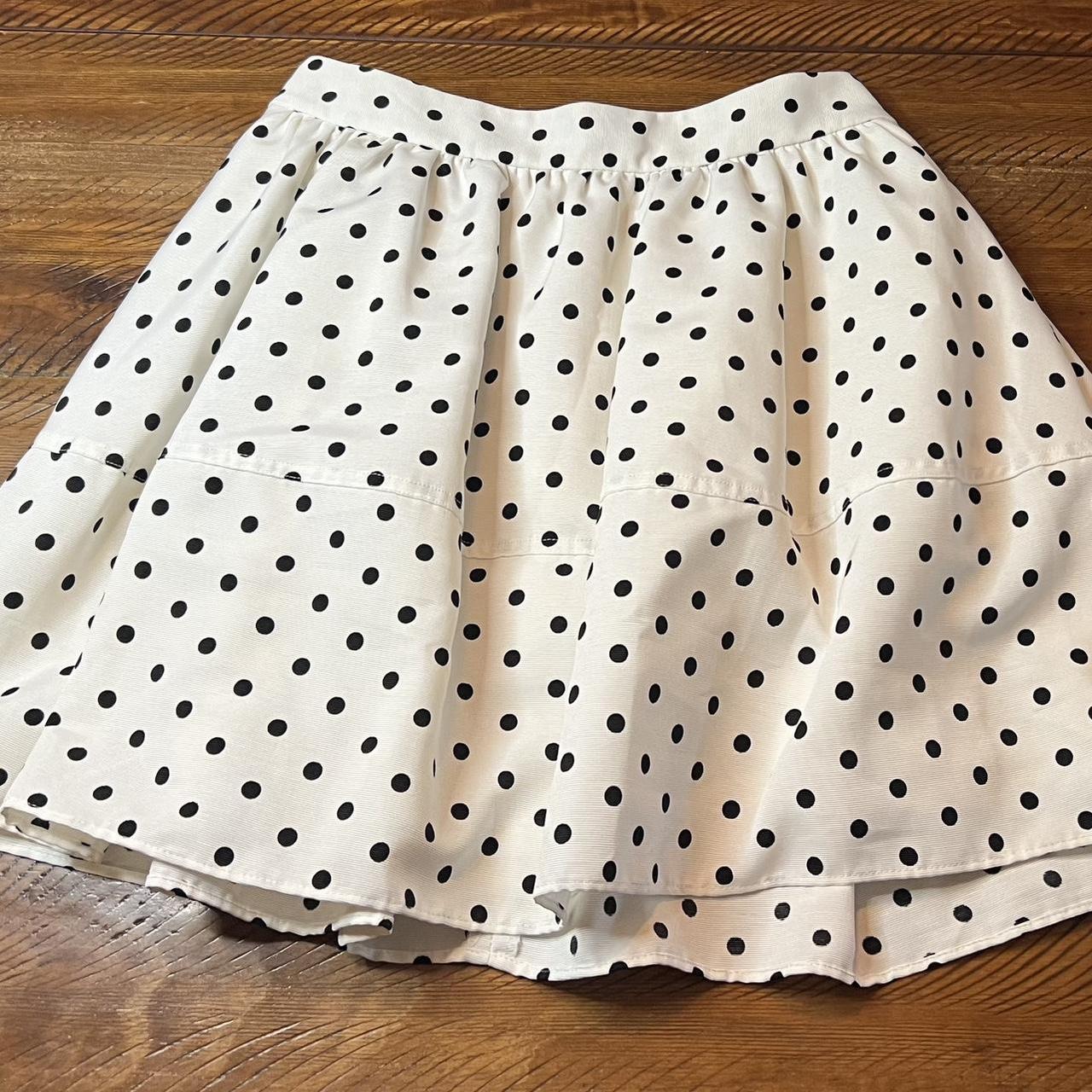 Express Super cute white with black polka dot. Depop