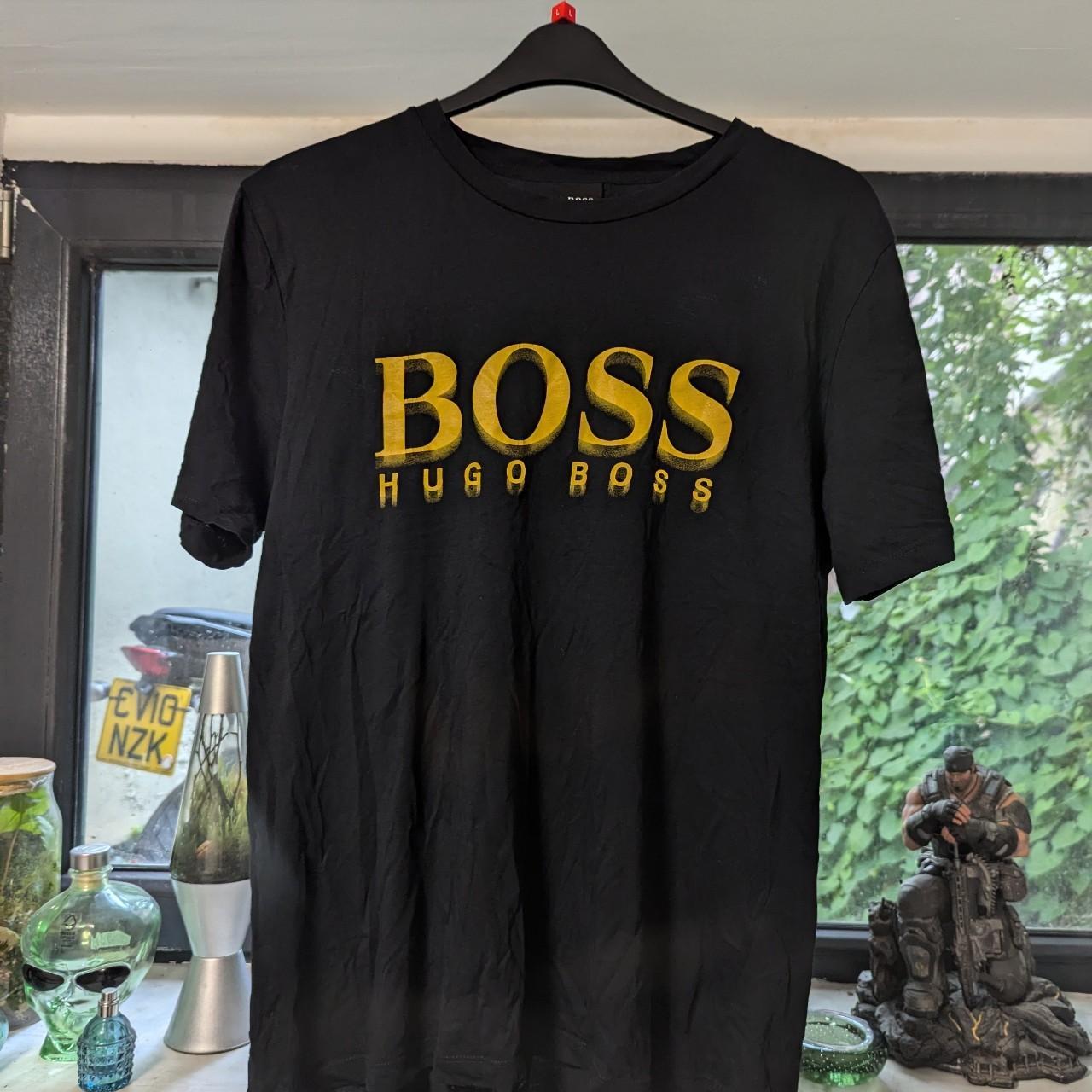 Black and orange gold Hugo Boss t shirt. Size is XL