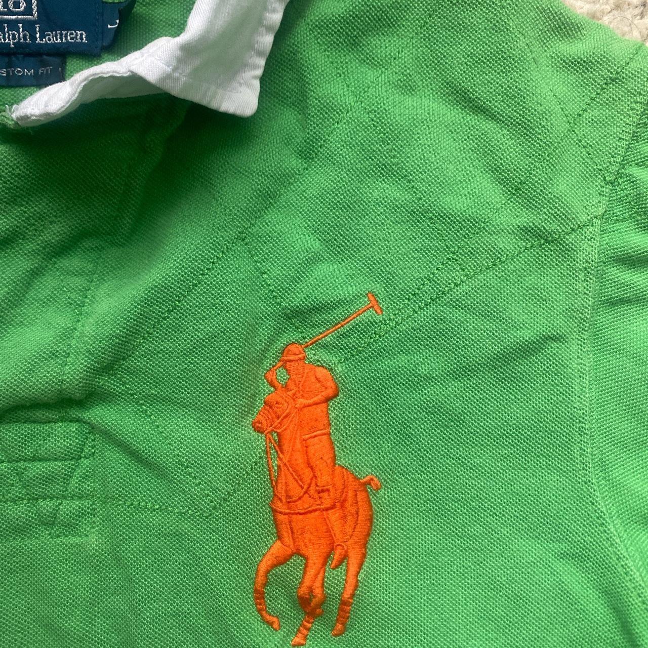 green polo shirt with orange horse