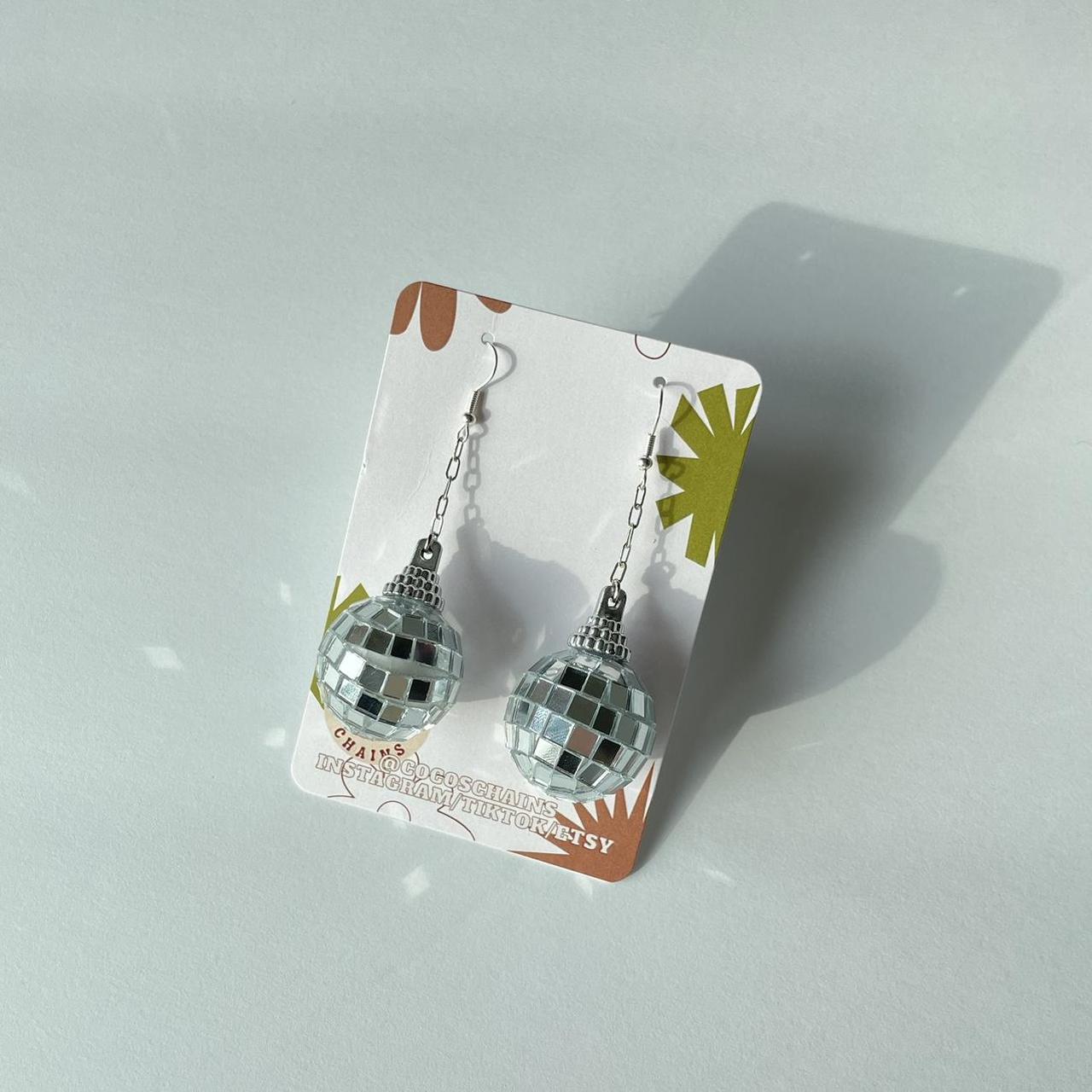 mirrorball taylor swift earrings! closure each pair... Depop