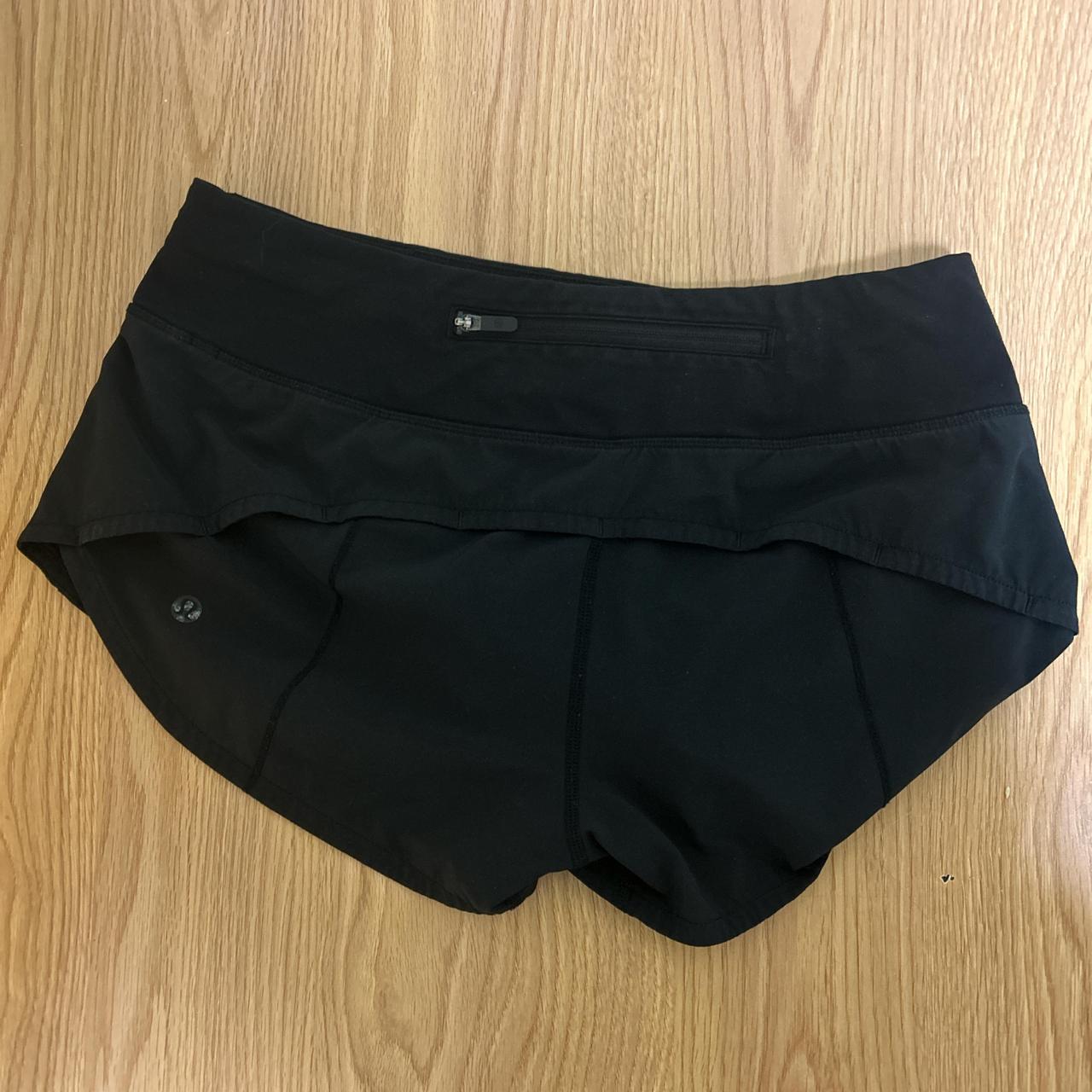 Black lululemon shorts, size 4, lulu symbol is worn... - Depop