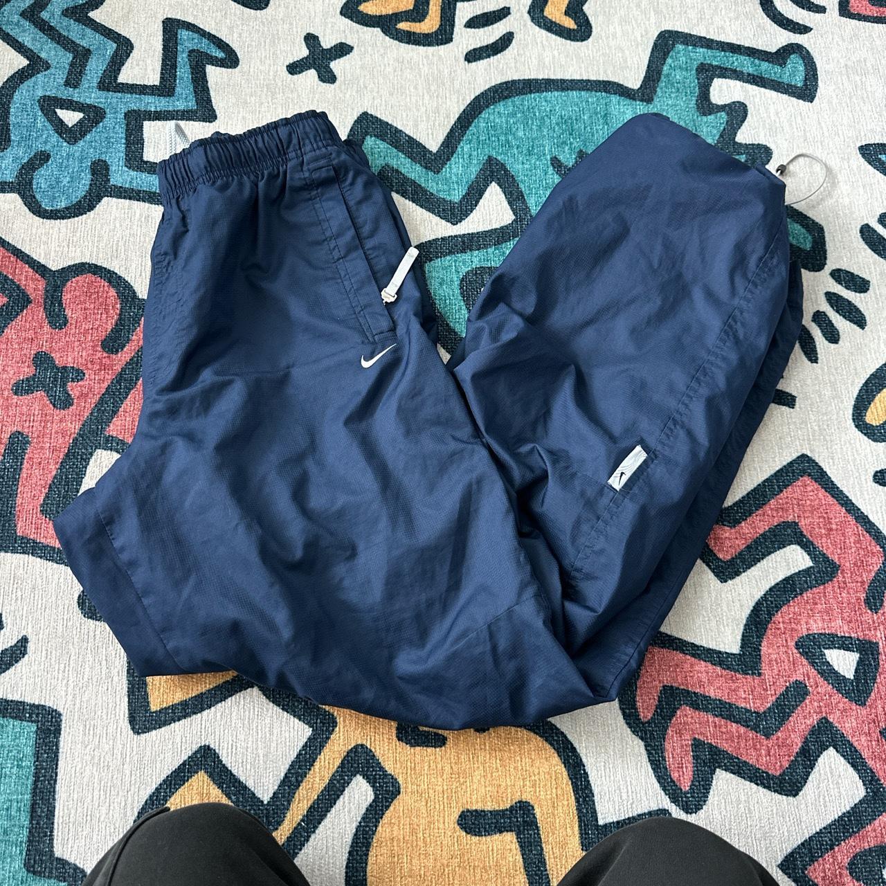 Nike parachute pants in navy size medium but fits me... - Depop