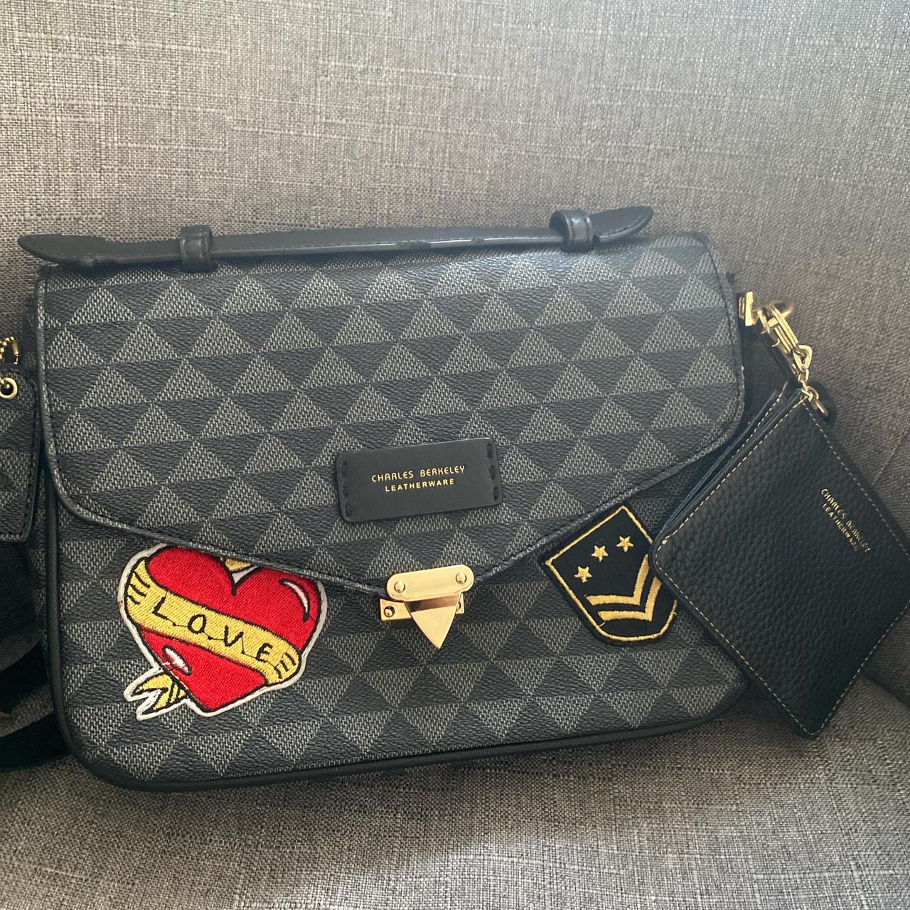 Small black leather bag with design on it.... Depop