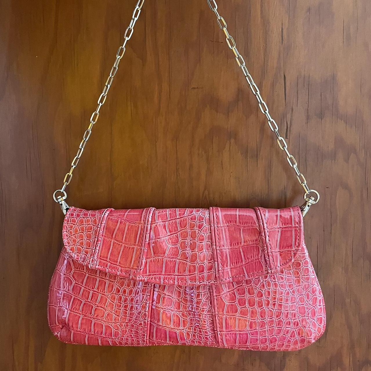 Thin, pink Nine West baguette bag