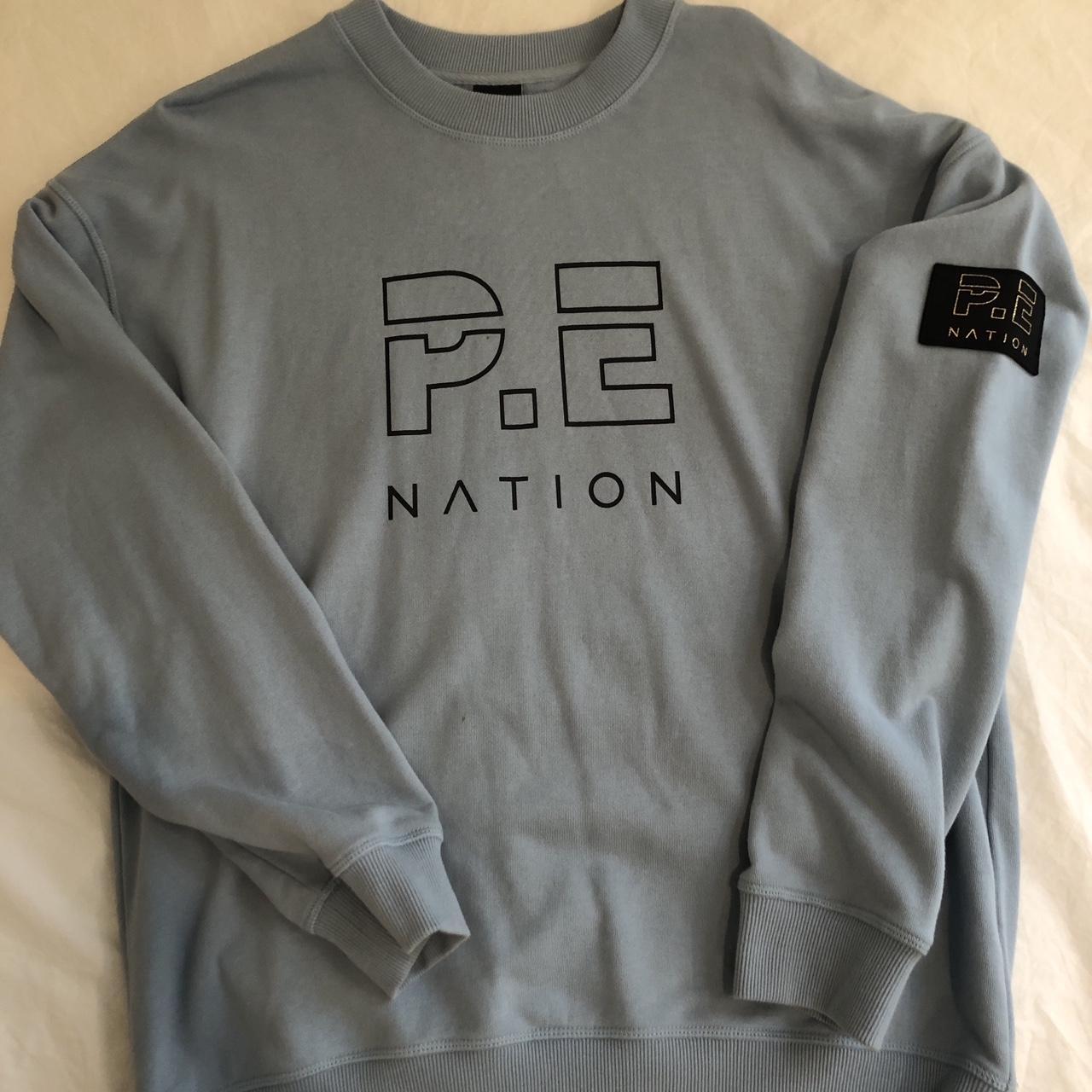 PE Nation baby blue jumper small stain as shown Depop