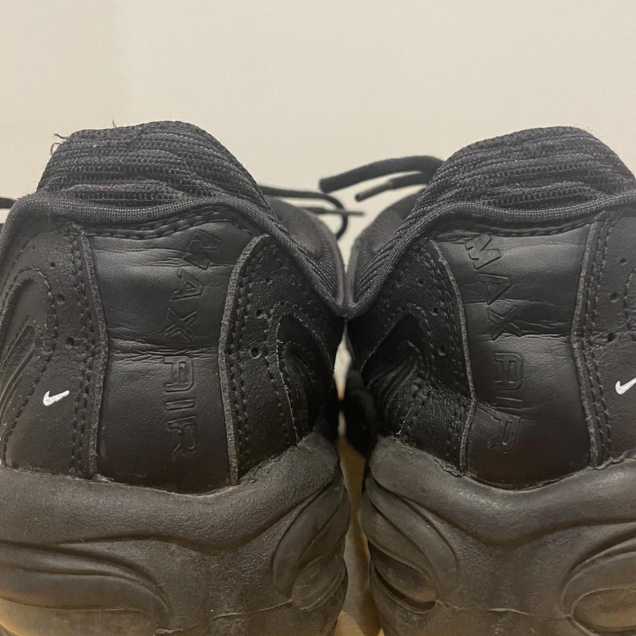 triple black nike tailwind