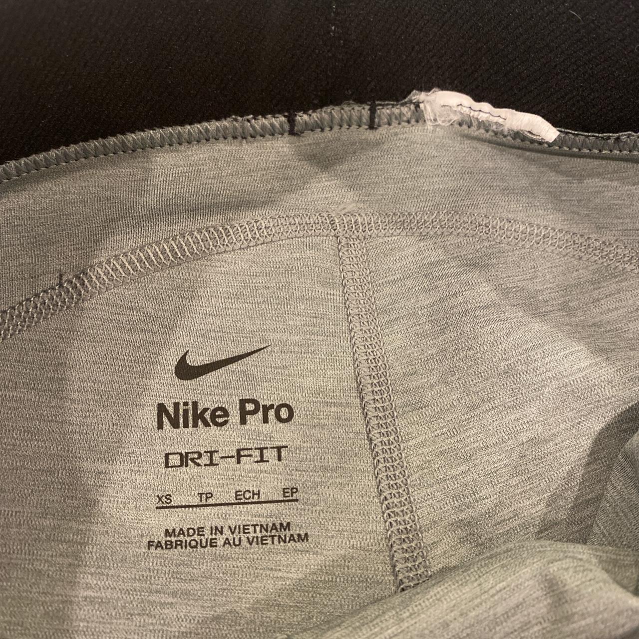 Grey Nike Pros with black and white Nike waistband.... - Depop