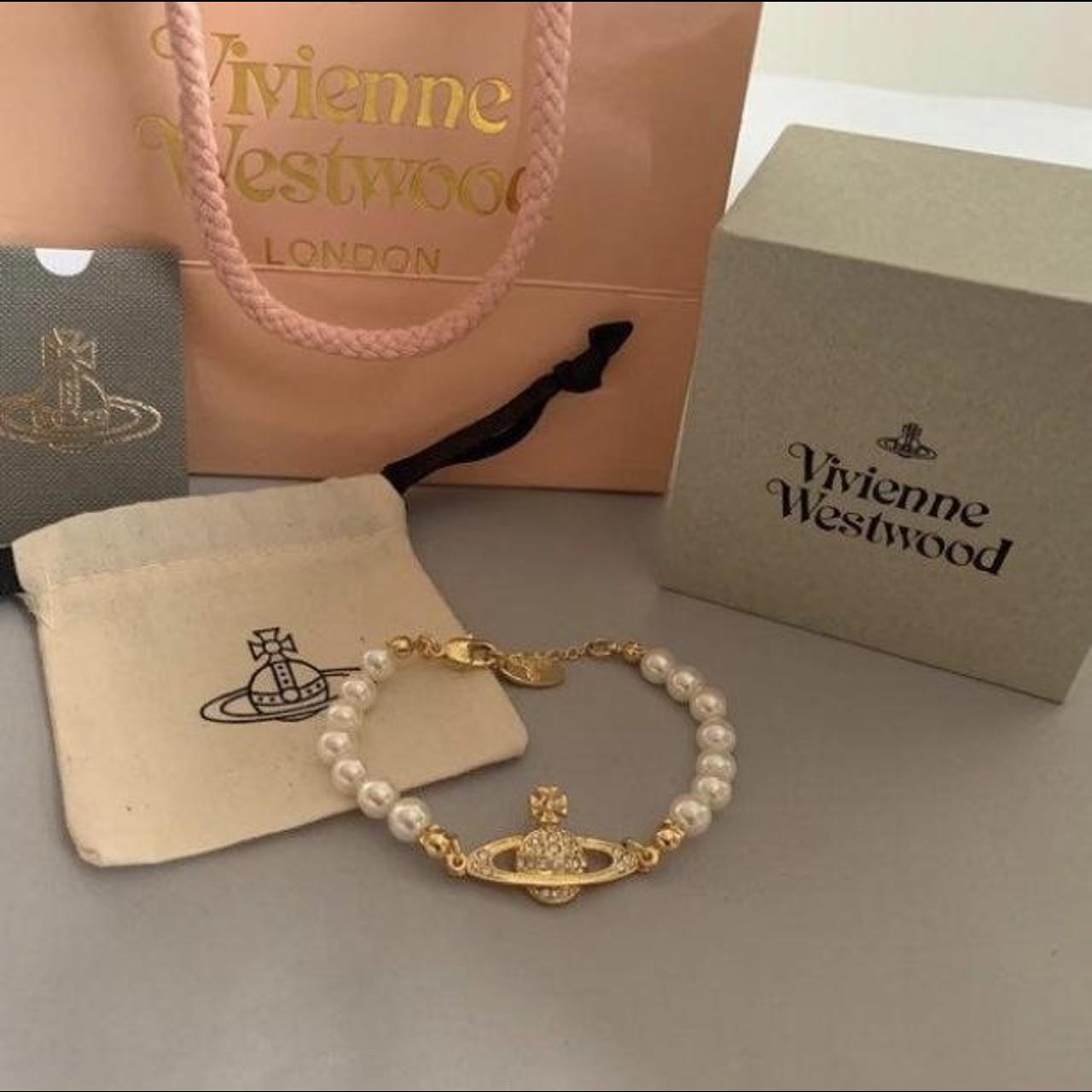 Vivienne Westwood Gold Saturn Pearl Bracelet.... - Depop