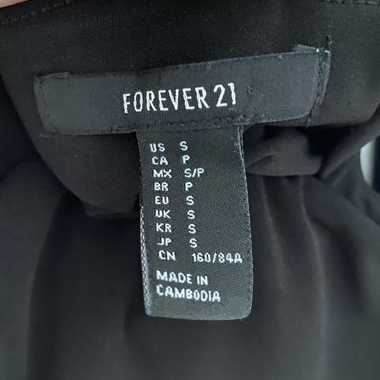 Black forever 21 flow mini dress Cross over back... Depop