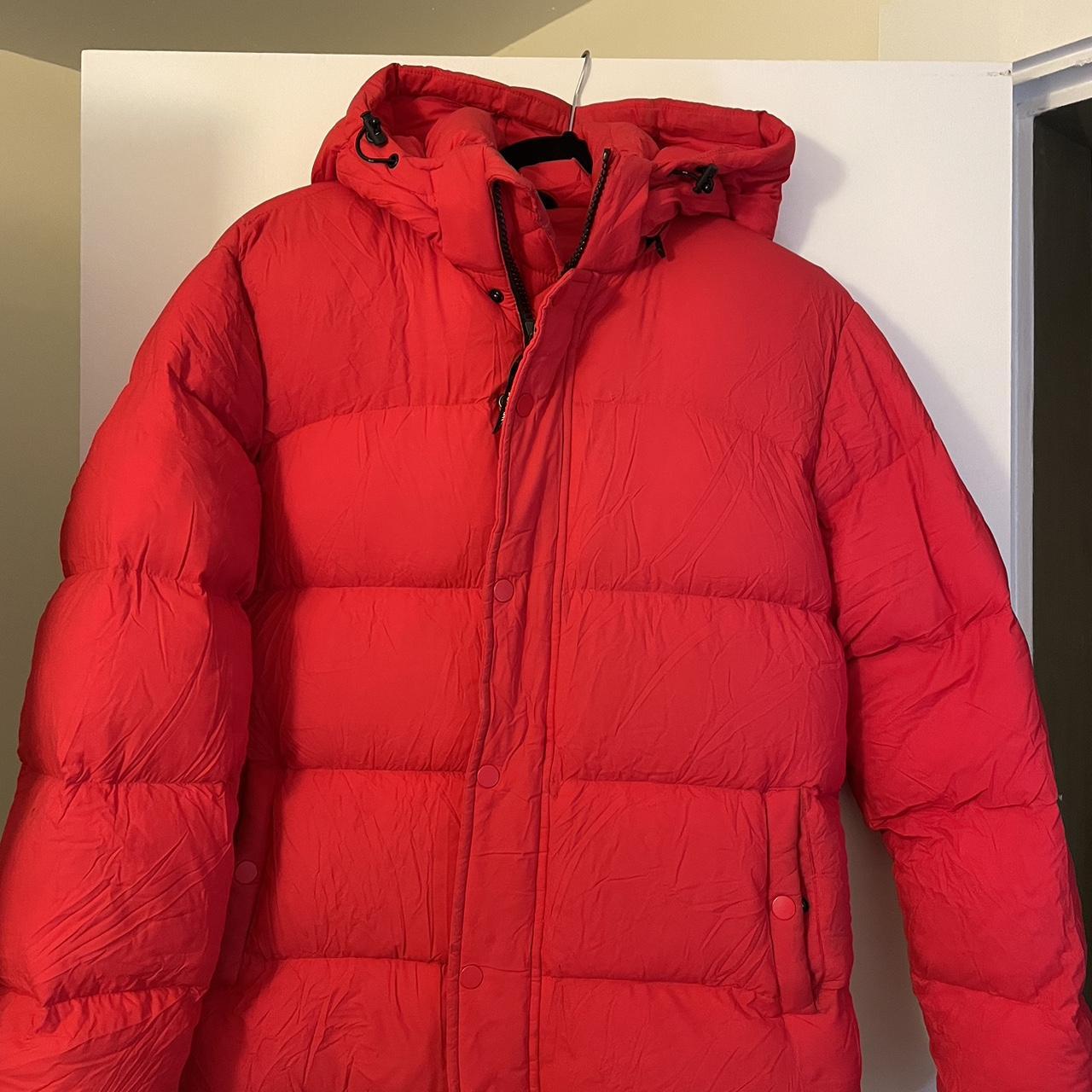 Red Aritzia super puff winter jacket. In very good... Depop
