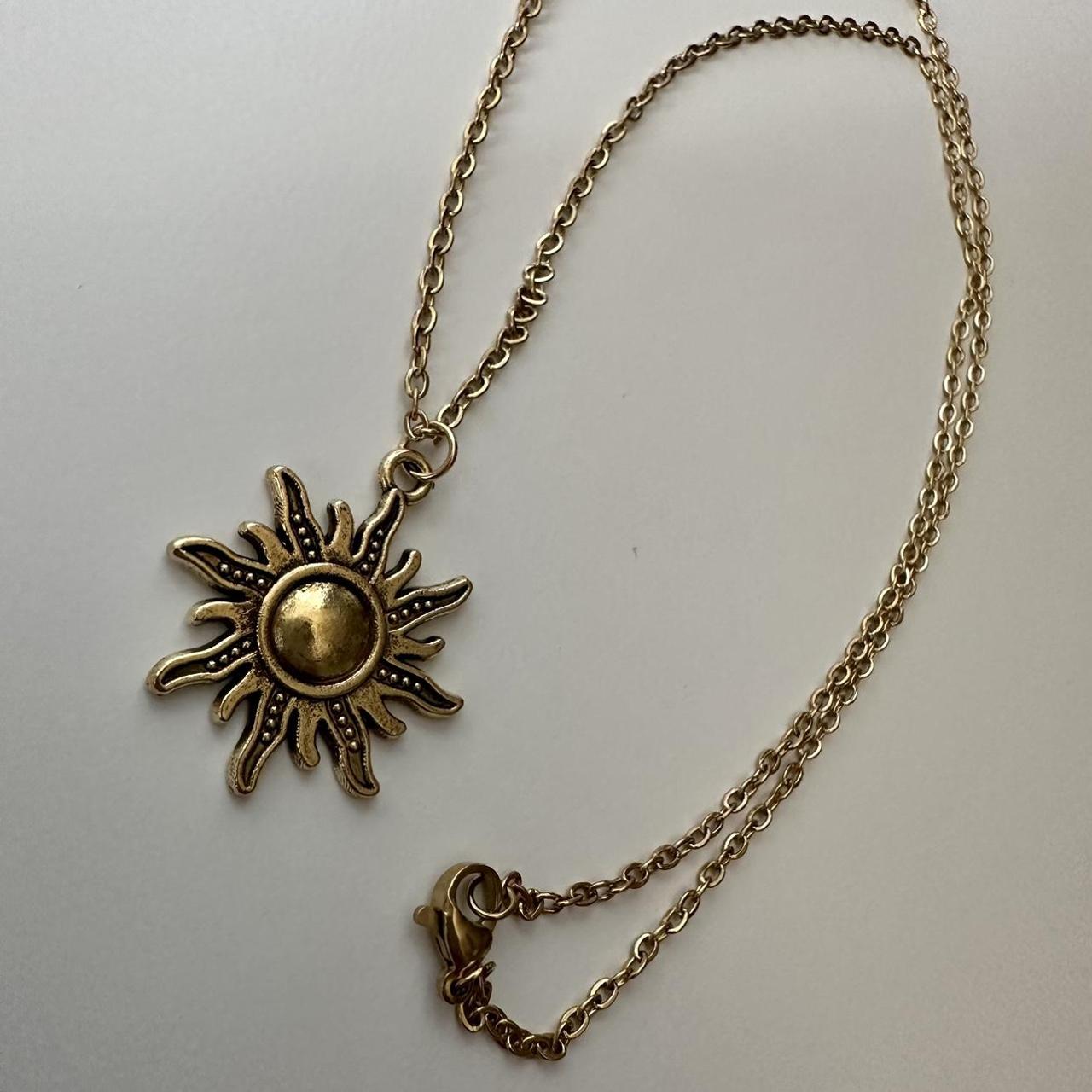 Rapunzel hot sale sun necklace