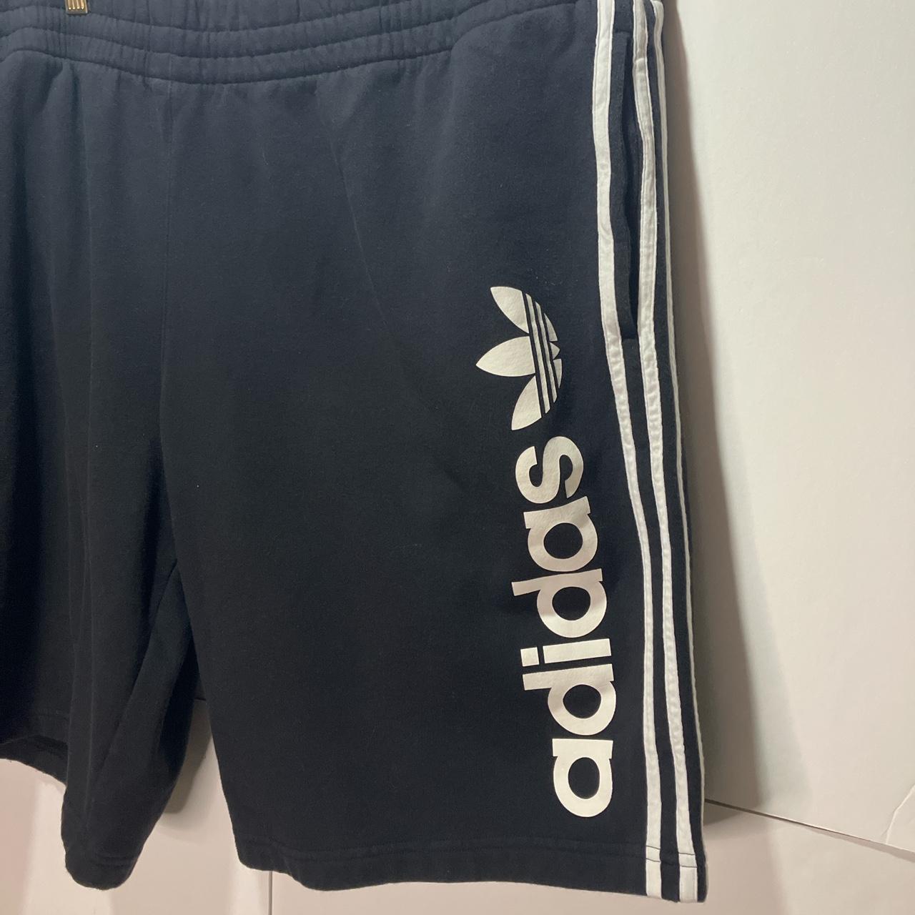 Adidas Originals Black athletic shorts with white - Depop