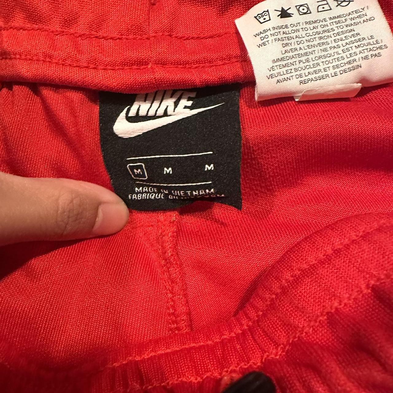 nike red swoosh tag