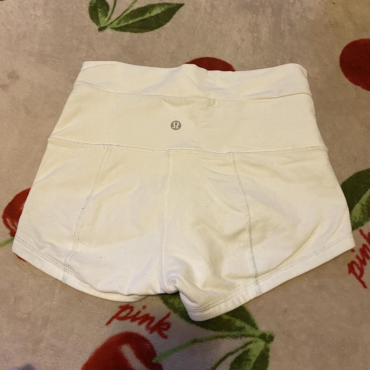 White Lululemon booty shorts labeled size 6 feel...