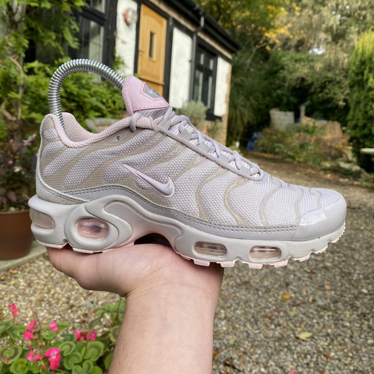 Pink nike air max plus womens hotsell