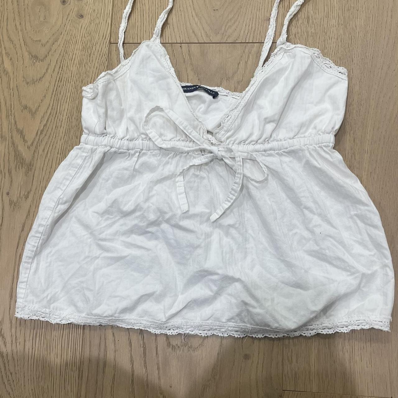 Brandy Melville White flowy tank top tanktop... Depop