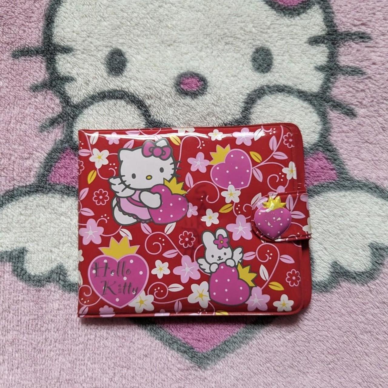 hello kitty cardholder wallet has some writing,... - Depop