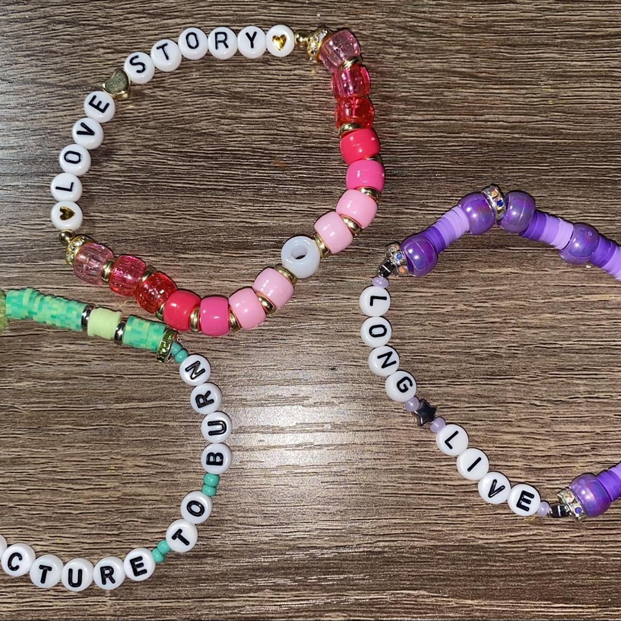 clay beads bracelets. one is purple with a flower - Depop