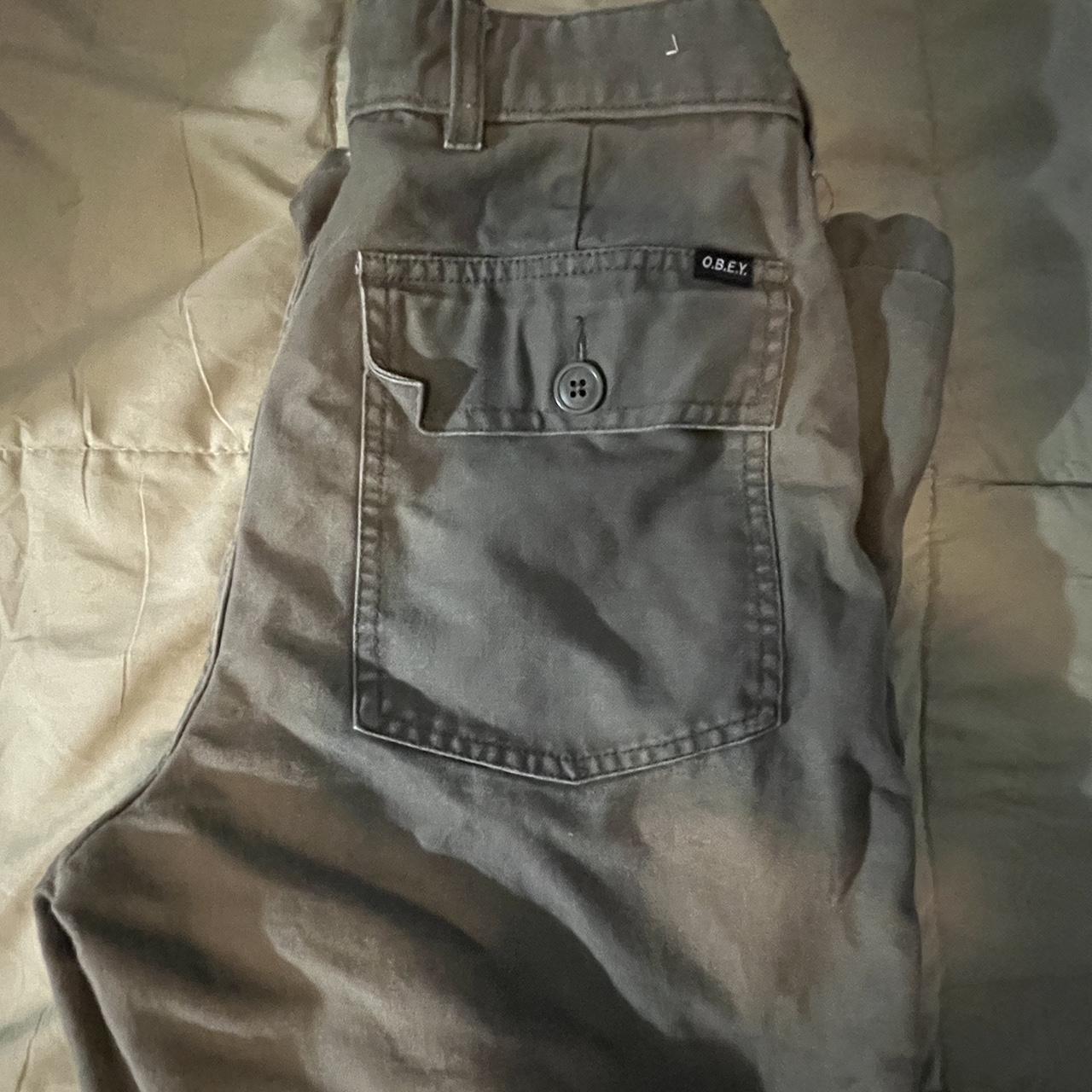Olive green OBEY pants only flaw is shown in the... - Depop