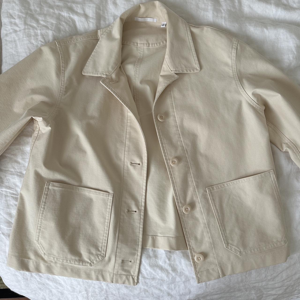 Uniqlo medium sized beige jacket. Has one small hole... Depop