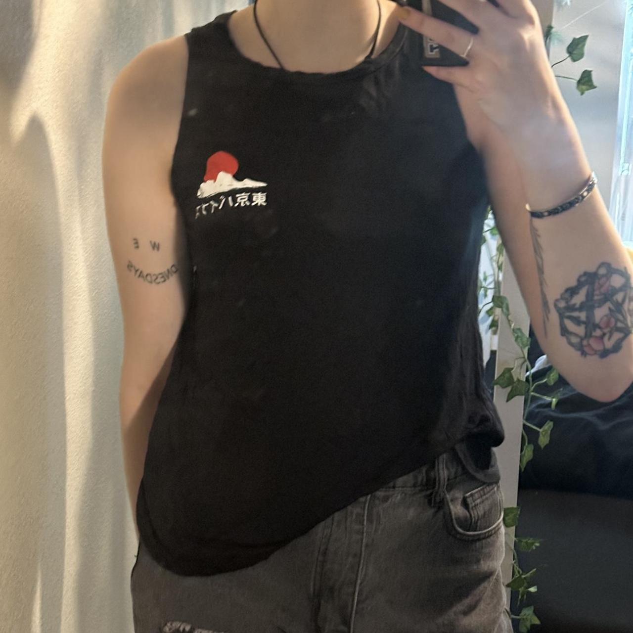Black graphic tank top. It’s super soft btw. Brand... Depop