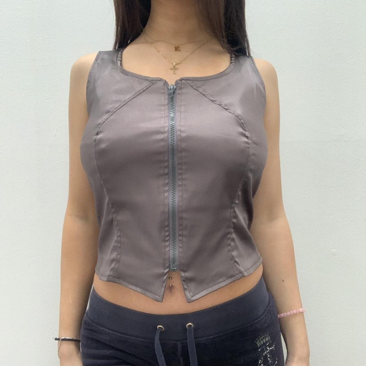 Silver suit style sleeveless top with zip down the... - Depop